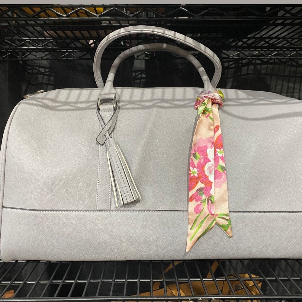 Elegant Gray Weekender with Floral Scarf Accent